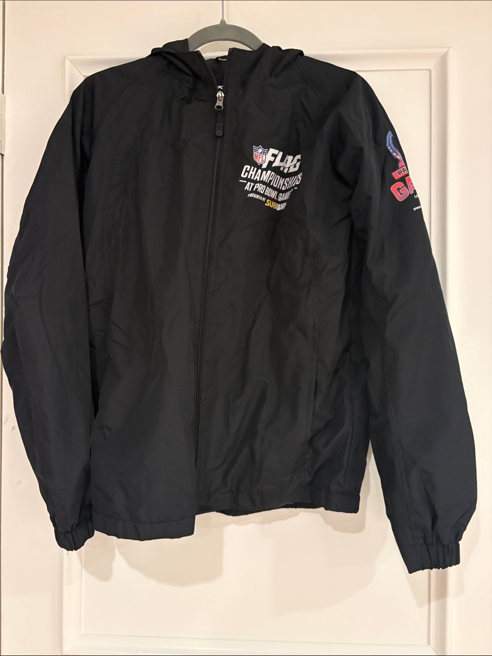 Sport-Tek Black Hooded Kids Rain Jacket with NFL Flag Championship Graphics